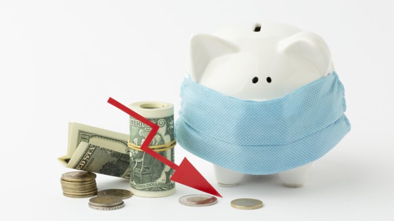 Influenza - Piggy bank wearing a medical mask with a red downward arrow pointing toward currency.